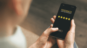 image of a user on their phone leaving a five star service review