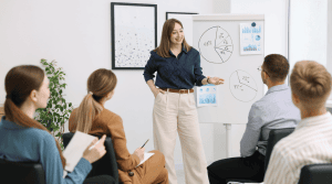 image of a woman speaking to a room full of people